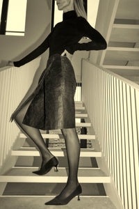 Styled view CAMILLA AND MARC Dawn Leather Skirt in Black Brown with a wrap midi silhouette.