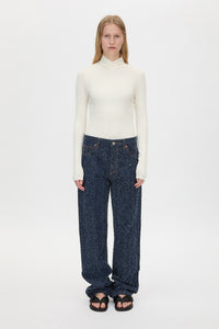 Front view CAMILLA AND MARC Axial Top in Cream styled with the Rune Neps Denim Jean.