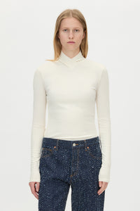Cropped view CAMILLA AND MARC Axial Top in Cream with layered cross‑over high neck.