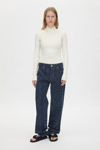 Front view CAMILLA AND MARC Axial Top in Cream with layered cross‑over high neck.