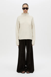 Front View CAMILLA AND MARC Atkinson Knit Sweater in ashen white with fitted turtleneck and oversized fit.