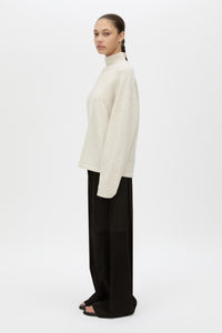 Side View CAMILLA AND MARC Atkinson Knit Sweater in ashen white with fitted turtleneck and oversized fit.