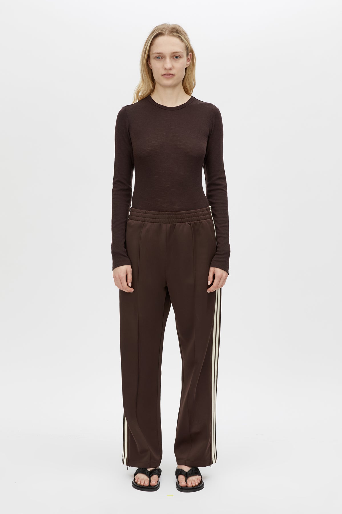 Front styled view CAMILLA AND MARC Locus Scuba Pant in Espresso with a mid‑rise fit and side‑stripe tape.