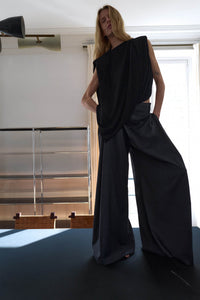 Styled view CAMILLA AND MARC Ravine Draped Top in Black with asymmetric silhouette.