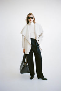 Front view CAMILLA AND MARC Audrey Wrap Jacket in Oat styled with the Tala Double Barrel Pant.
