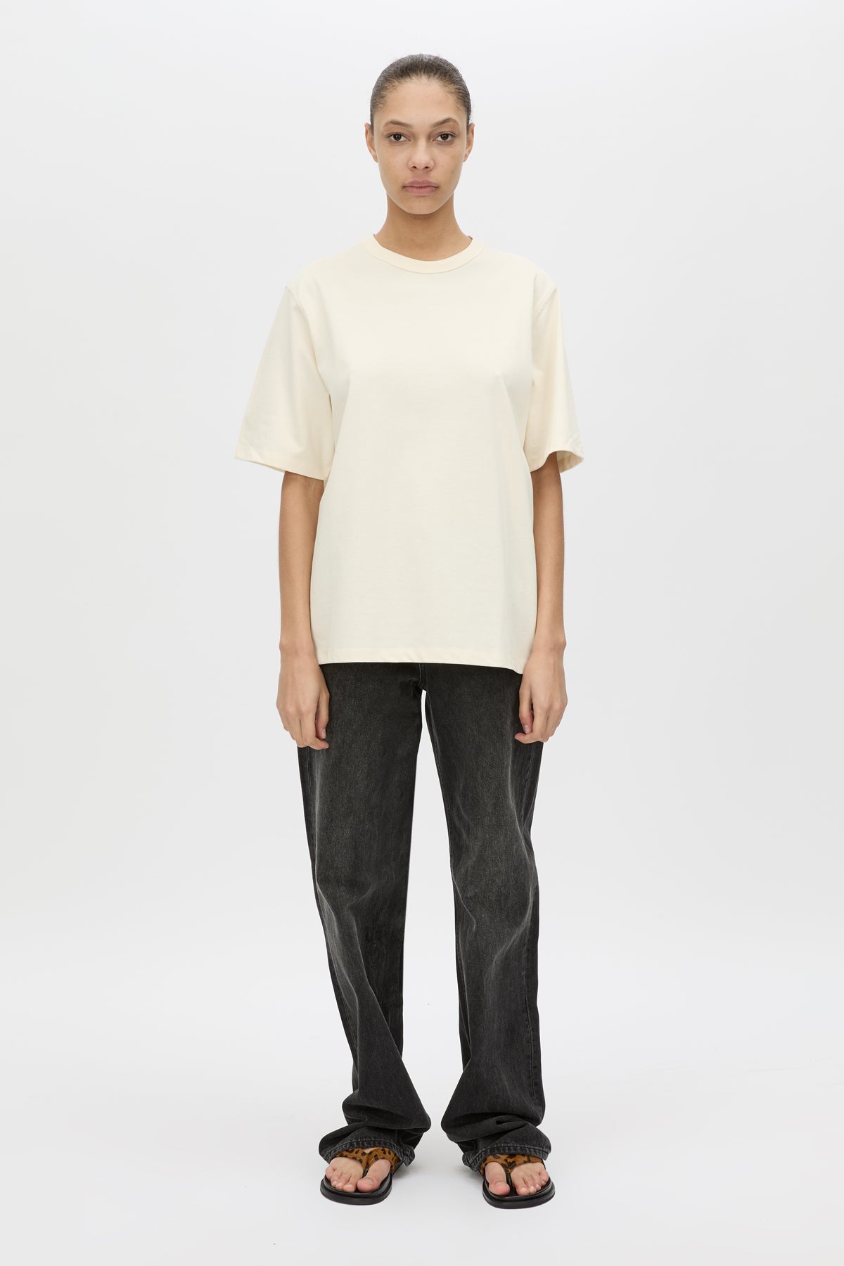 Front view CAMILLA AND MARC Studio Graphic Tee in White with short sleeves and boucle embroidered monogram.  