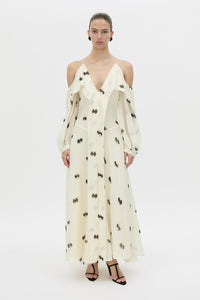 Front-styled view CAMILLA AND MARC Adel Long Sleeve Maxi Dress with adjustable straps and exposed shoulder sleeves.