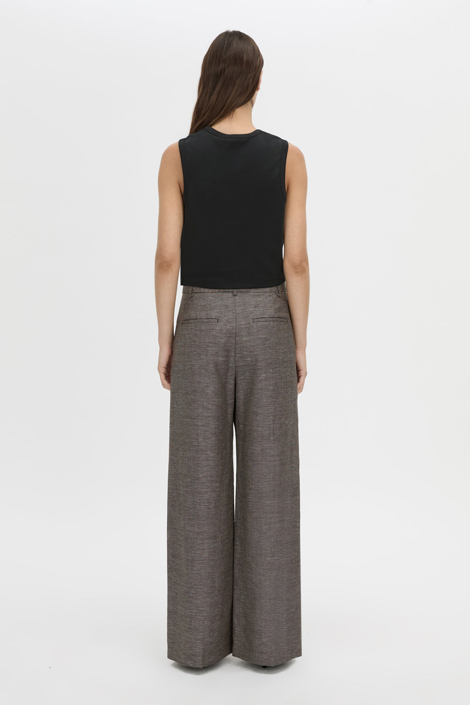 Back view CAMILLA AND MARC Alba Crop Rib Tank in black with bound low armholes and neckline.