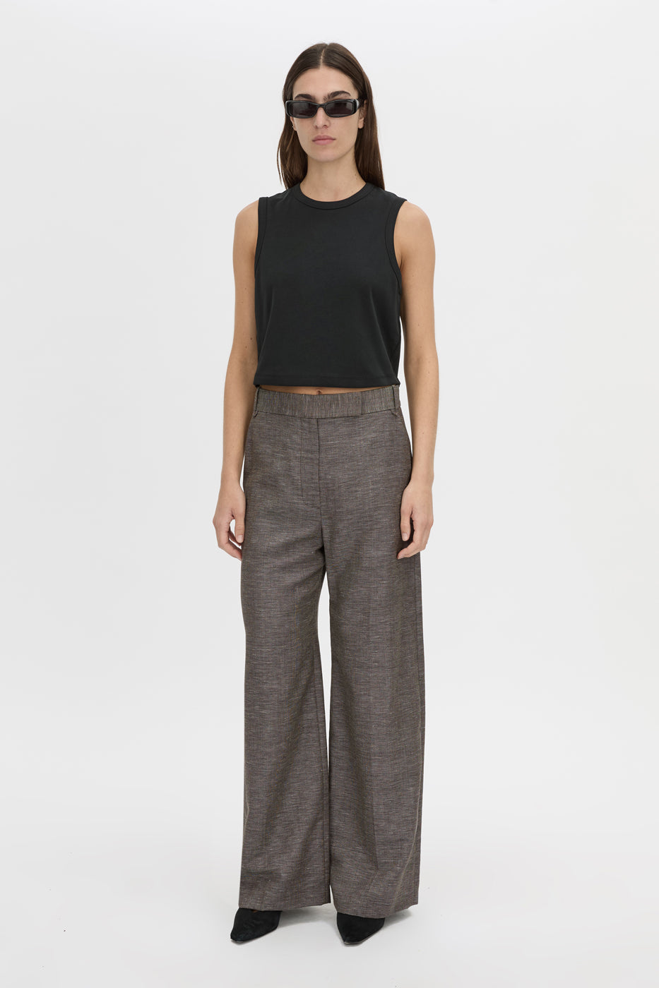 Front-styled view CAMILLA AND MARC Alba Crop Rib Tank in black with bound low armholes and neckline.