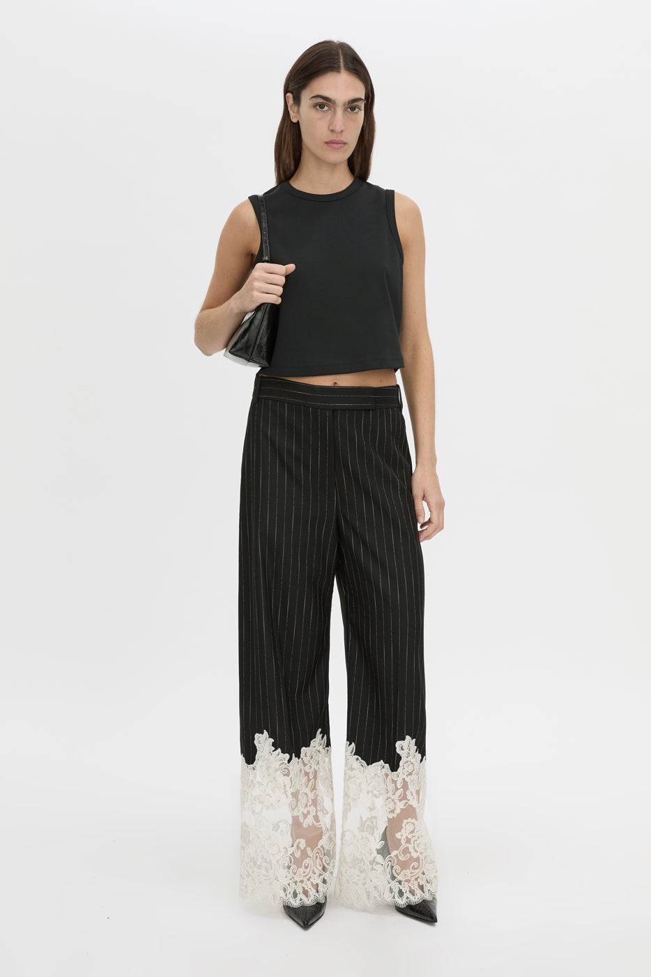 Front-styled view CAMILLA AND MARC wide-leg Alvar Lace Pant in black and white stripe with scalloped lace hem.