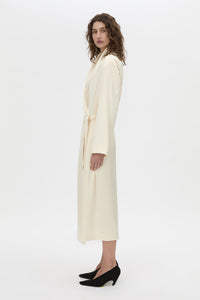 Side view CAMILLA AND MARC Arion Shawl Collar Dress in cream with wrapped robe-style design.