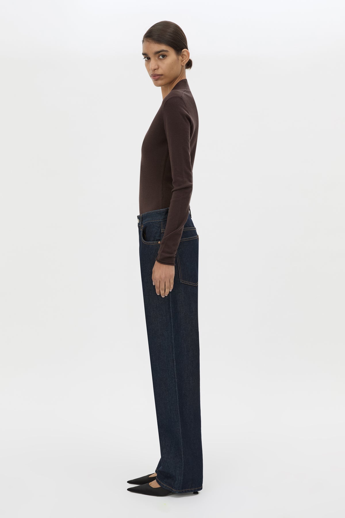 Side view CAMILLA AND MARC Ashlar Knit Bodysuit in Espresso Brown with long sleeves and deep V‑neck.