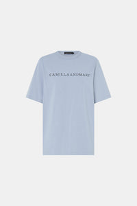 Ghost view CAMILLA AND MARC Athea short sleeve monogram tee in sky blue with contrast logo print.