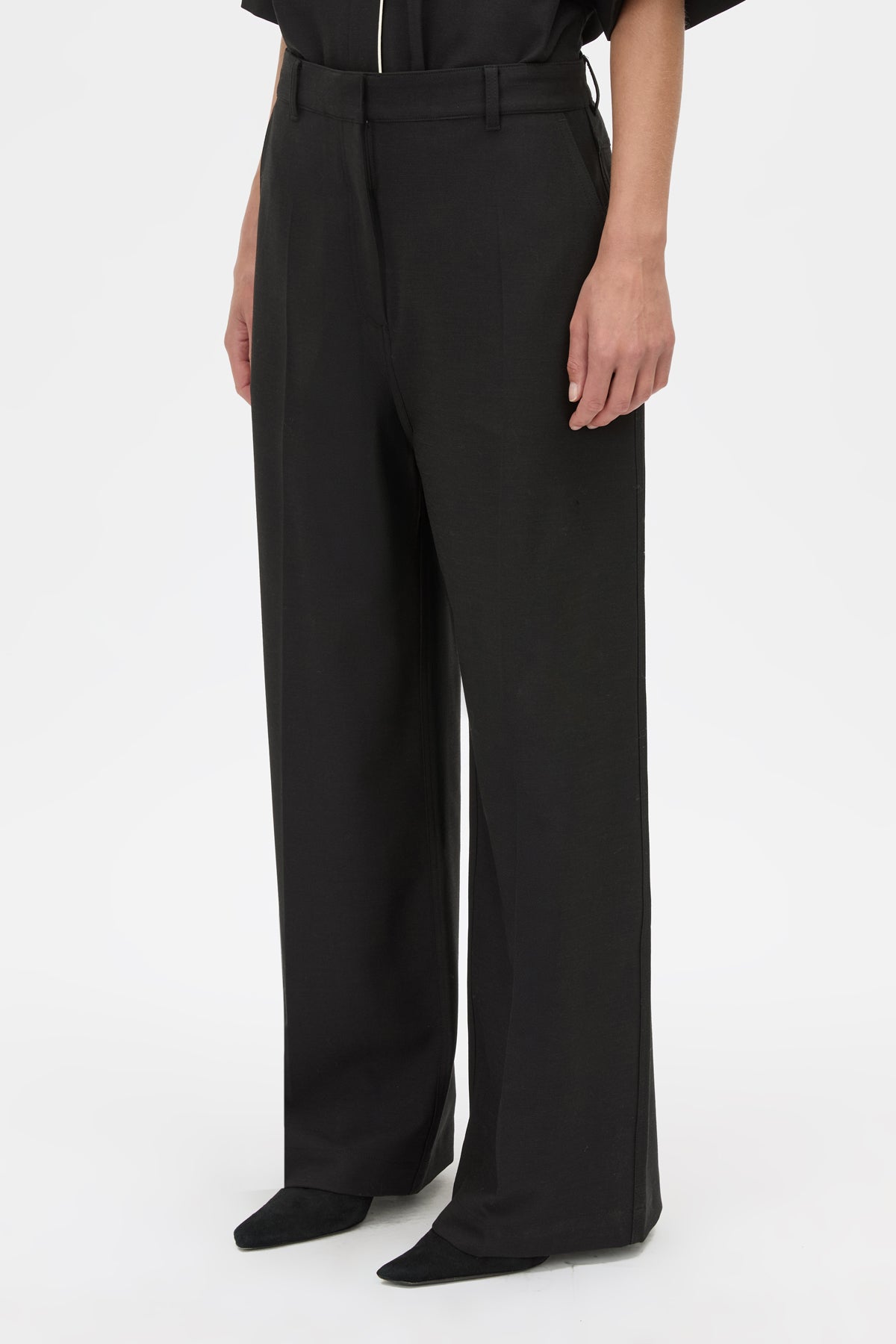 Detail View - CAMILLA AND MARC Atticus Pant in black with a low-rise, wide leg silhouette. 