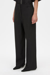 Detail View - CAMILLA AND MARC Atticus Pant in black with a low-rise, wide leg silhouette. 