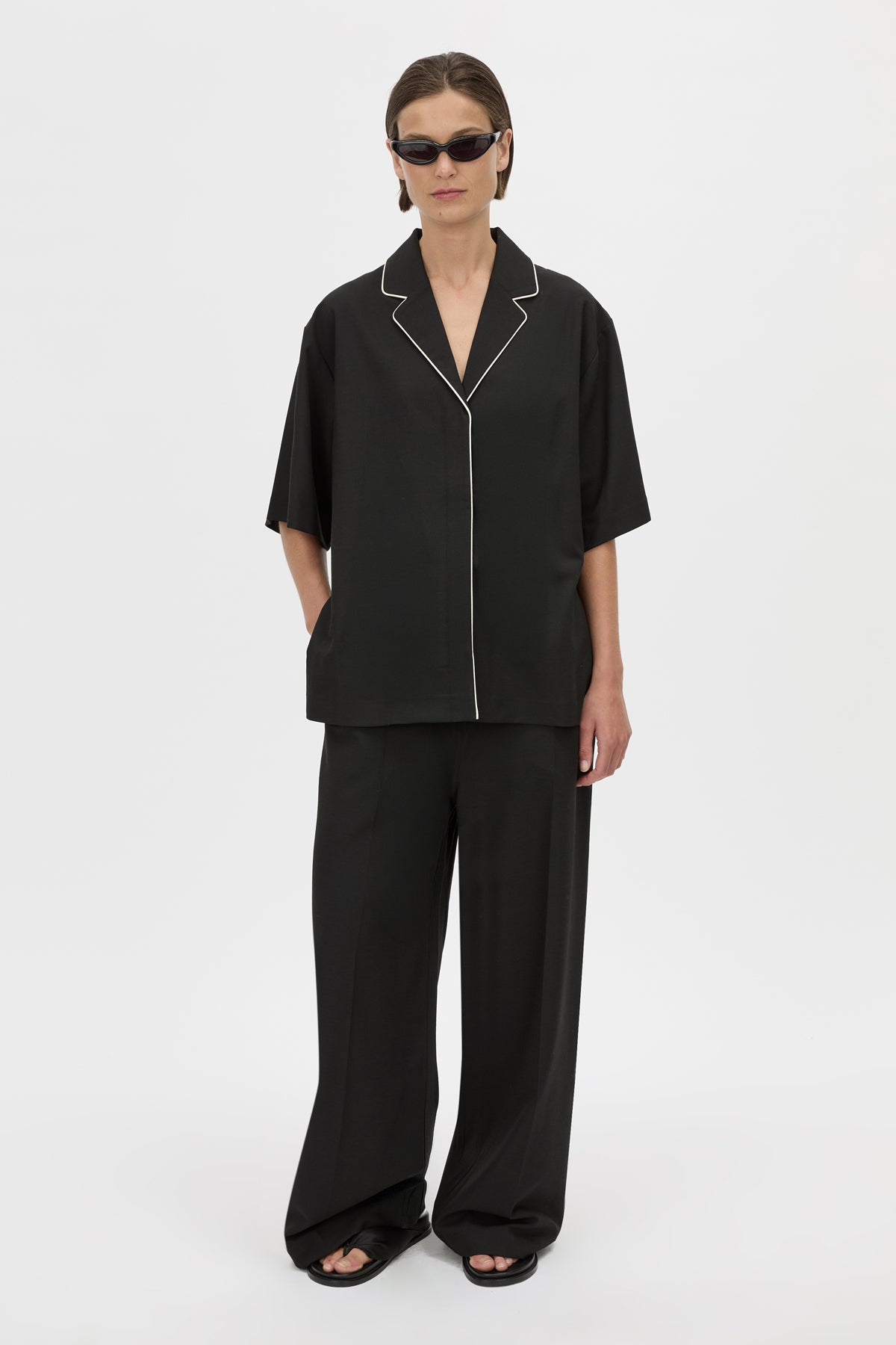 Styled View - CAMILLA AND MARC Atticus Pant in black with a low-rise, wide leg silhouette. 