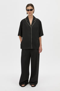 Styled View - CAMILLA AND MARC Atticus Pant in black with a low-rise, wide leg silhouette. 