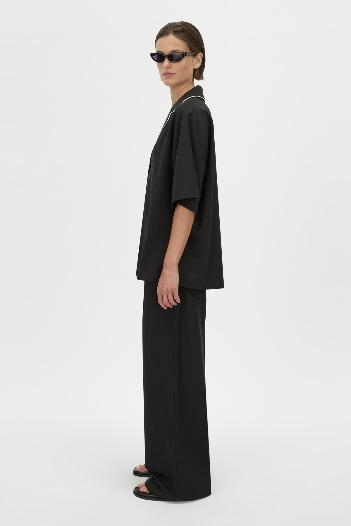 Side View - CAMILLA AND MARC collared Atticus Short Sleeve Shirt in black with contrast cord piping. 