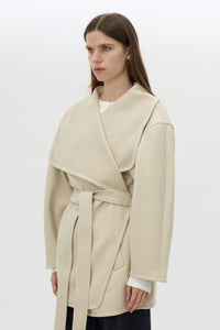 Cropped view CAMILLA AND MARC Audrey Wrap Jacket in oat with relaxed belted silhouette.