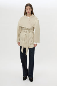 Front view CAMILLA AND MARC Audrey Wrap Jacket in oat with relaxed belted silhouette.