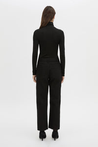 Back view CAMILLA AND MARC Barre turtleneck long sleeve top in black.