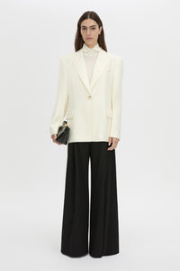 Front-styled view CAMILLA AND MARC Barre turtleneck long-sleeve top in soft white.