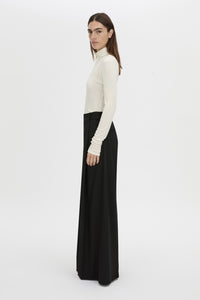 Side view CAMILLA AND MARC Barre turtleneck long-sleeve top in soft white.