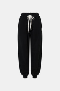 Ghost view CAMILLA AND MARC Bonnie relaxed logo track pant in black with elasticated drawcord waistband.
