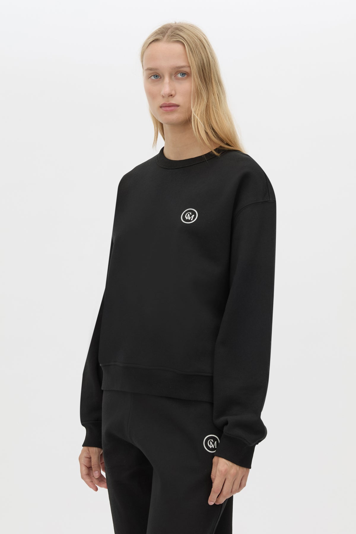 Cropped view CAMILLA AND MARC Bonnie Small Graphic Sweater in Black with relaxed fit and circle flocked artwork. 