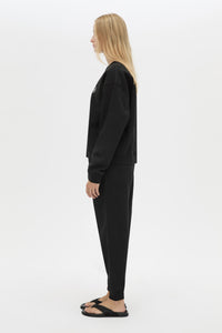 Side view CAMILLA AND MARC Bonnie Small Graphic Sweater in Black with relaxed fit and circle flocked artwork. 