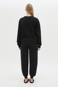 Back view CAMILLA AND MARC Bonnie Small Graphic Sweater in Black with relaxed fit and circle flocked artwork. 