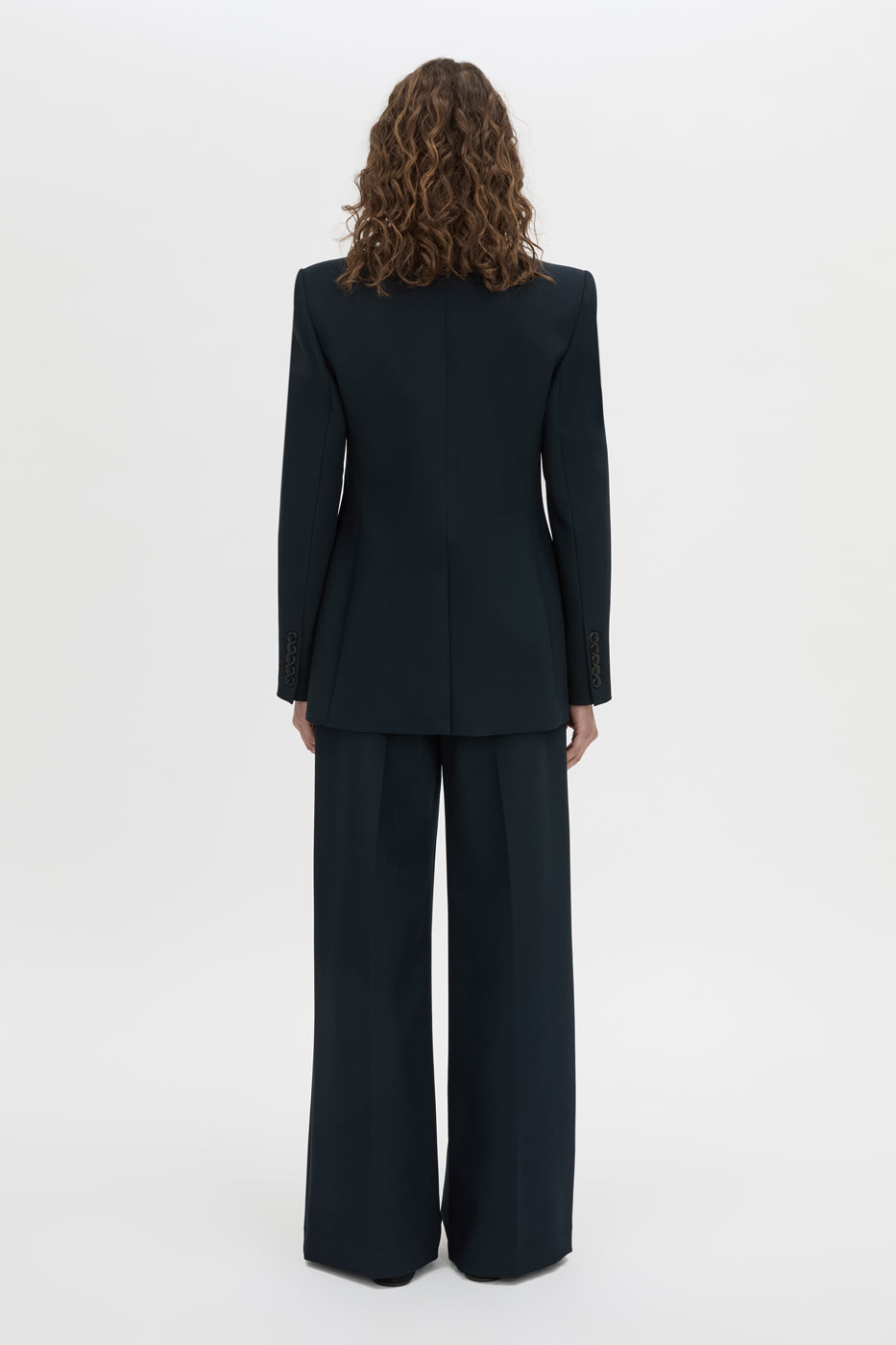 Back view CAMILLA AND MARC Bostan Blazer in a tailored navy fabrication, single-breasted silhouette, sharp shoulder pads, flap welt pockets, chest mock welt pocket, centre back vent and fully lined.
