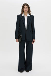 Front-styled view CAMILLA AND MARC Bostan Blazer in a tailored navy fabrication, single-breasted silhouette, sharp shoulder pads, flap welt pockets, chest mock welt pocket, centre back vent and fully lined.