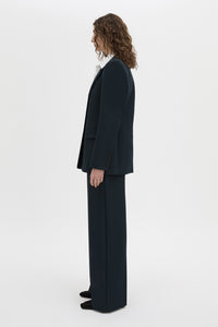 Side view CAMILLA AND MARC Bostan Blazer in a tailored navy fabrication, single-breasted silhouette, sharp shoulder pads, flap welt pockets, chest mock welt pocket, centre back vent and fully lined.