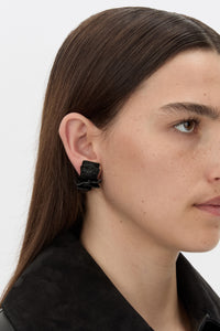 Styled view CAMILLA AND MARC Brinna Textured Earrings with gloss black plated finish.