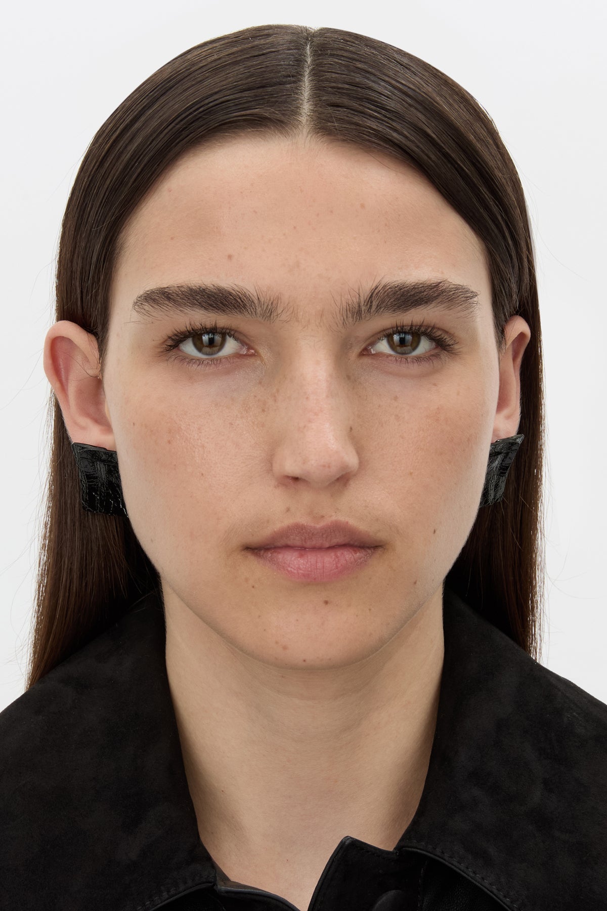 Front styled view CAMILLA AND MARC Brinna Layered Textured Earrings in black.