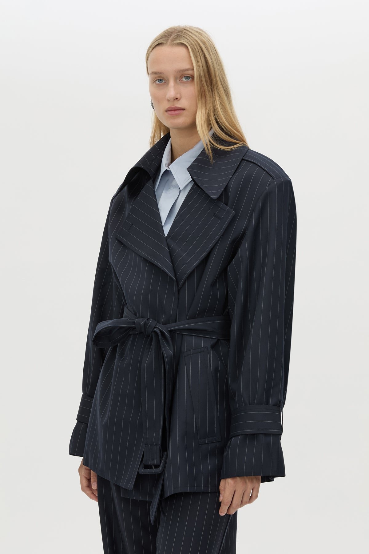 Cropped view CAMILLA AND MARC Brody Short Trench Coat in Navy Stripe with a relaxed silhouette.