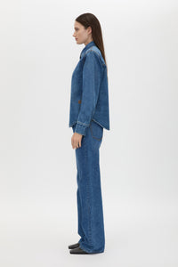 Side view CAMILLA AND MARC Caden Denim Shirt in Dark Classic Blue with shoulder pads and an embroidered monogram.