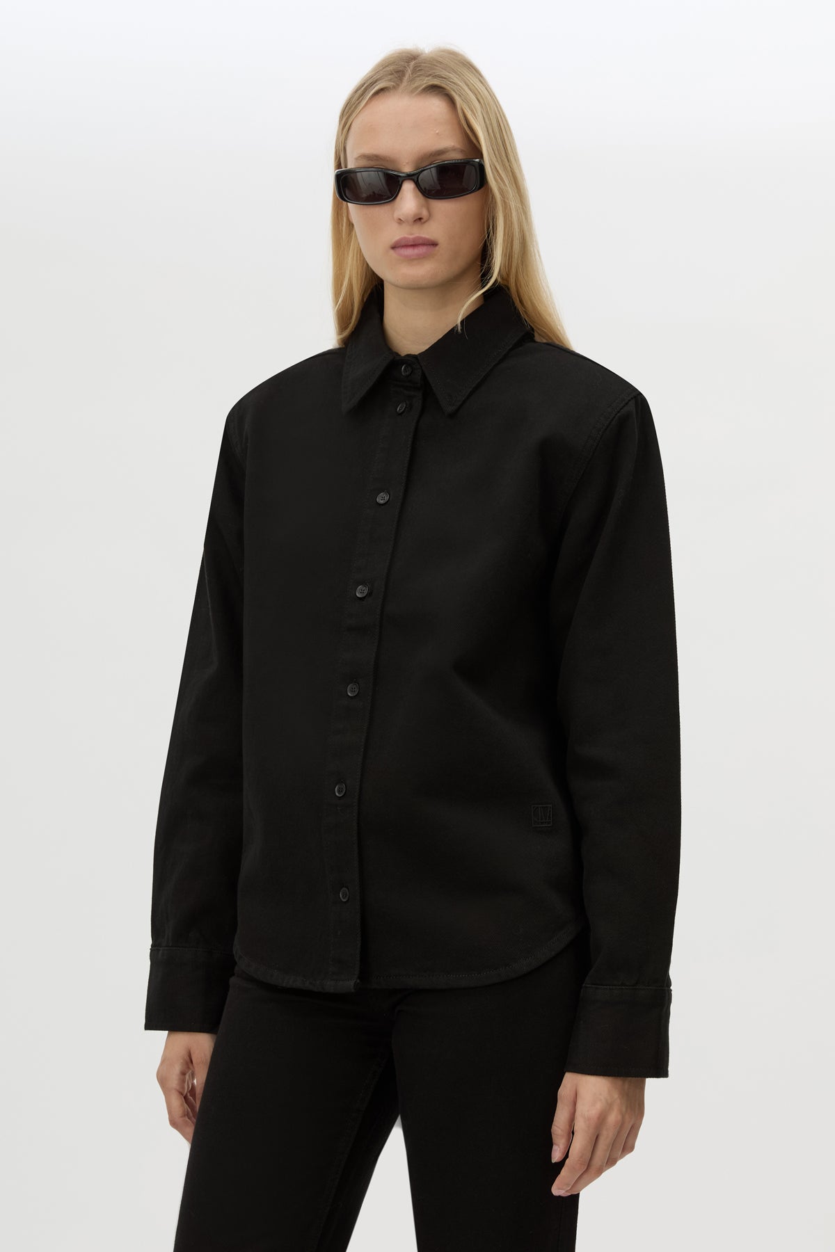 Cropped view CAMILLA AND MARC Caden Denim Shirt in True Black with shoulder pads and embroidered monogram detailing.