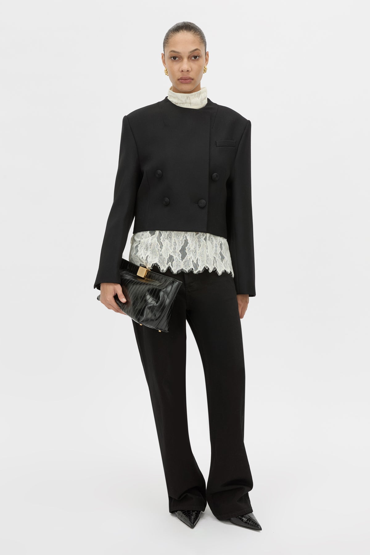 Front-styled view CAMILLA AND MARC double-breasted Caius Relaxed Cropped Blazer in black with a collarless neckline.