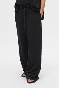 Cropped view CAMILLA AND MARC Canova Relaxed Pant in Black jersey with gathered waistband and drawcord.