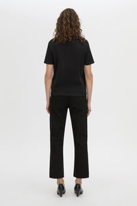 Back view CAMILLA AND MARC short sleeve Carmen Shoulder Pad Tee in black with strong shoulder design. 