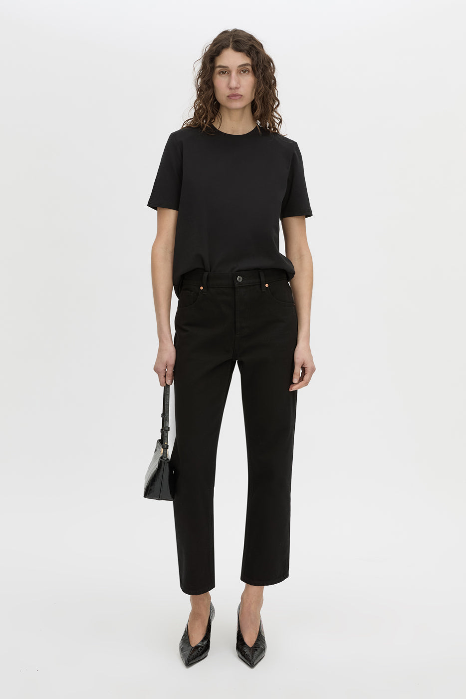 Front view CAMILLA AND MARC short sleeve Carmen Shoulder Pad Tee in black with strong shoulder design. 