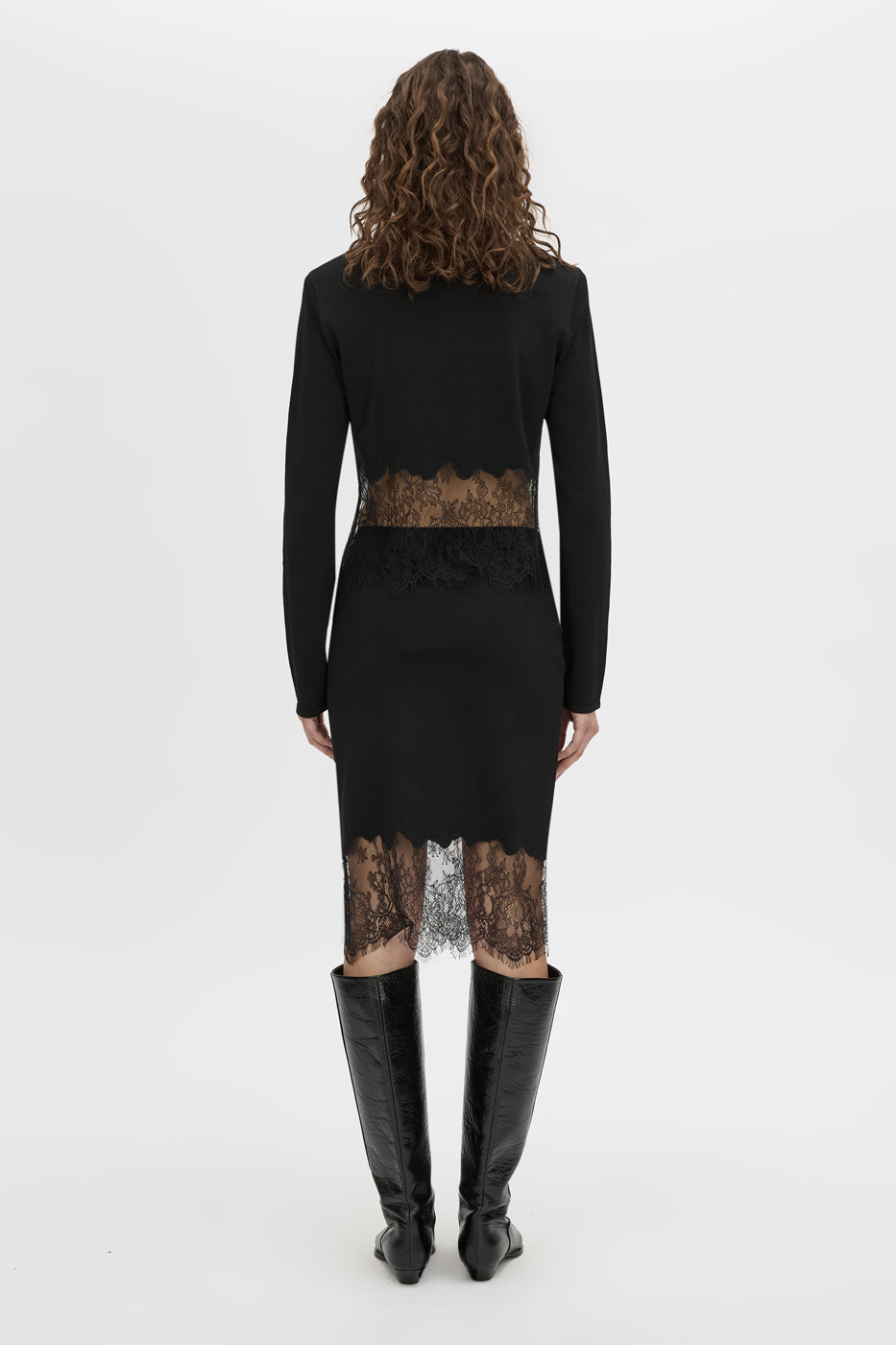 Back view CAMILLA AND MARC Cayana Lace Knit Skirt in black with knit knee length design and lace hem detail.