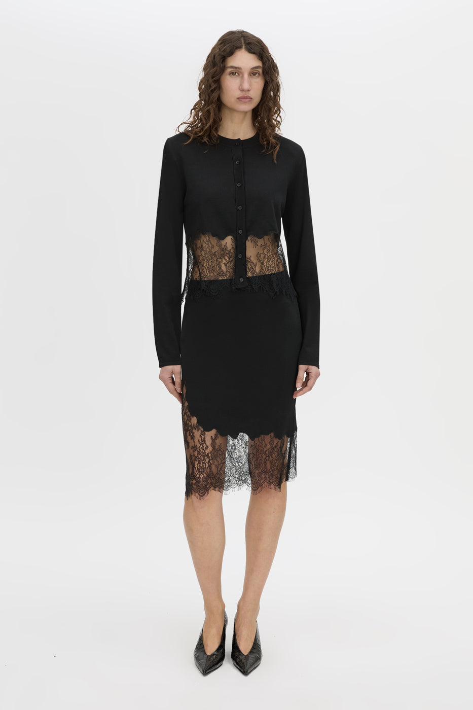 Front view CAMILLA AND MARC Cayana Lace Knit Skirt in black with knit knee length design and lace hem detail.