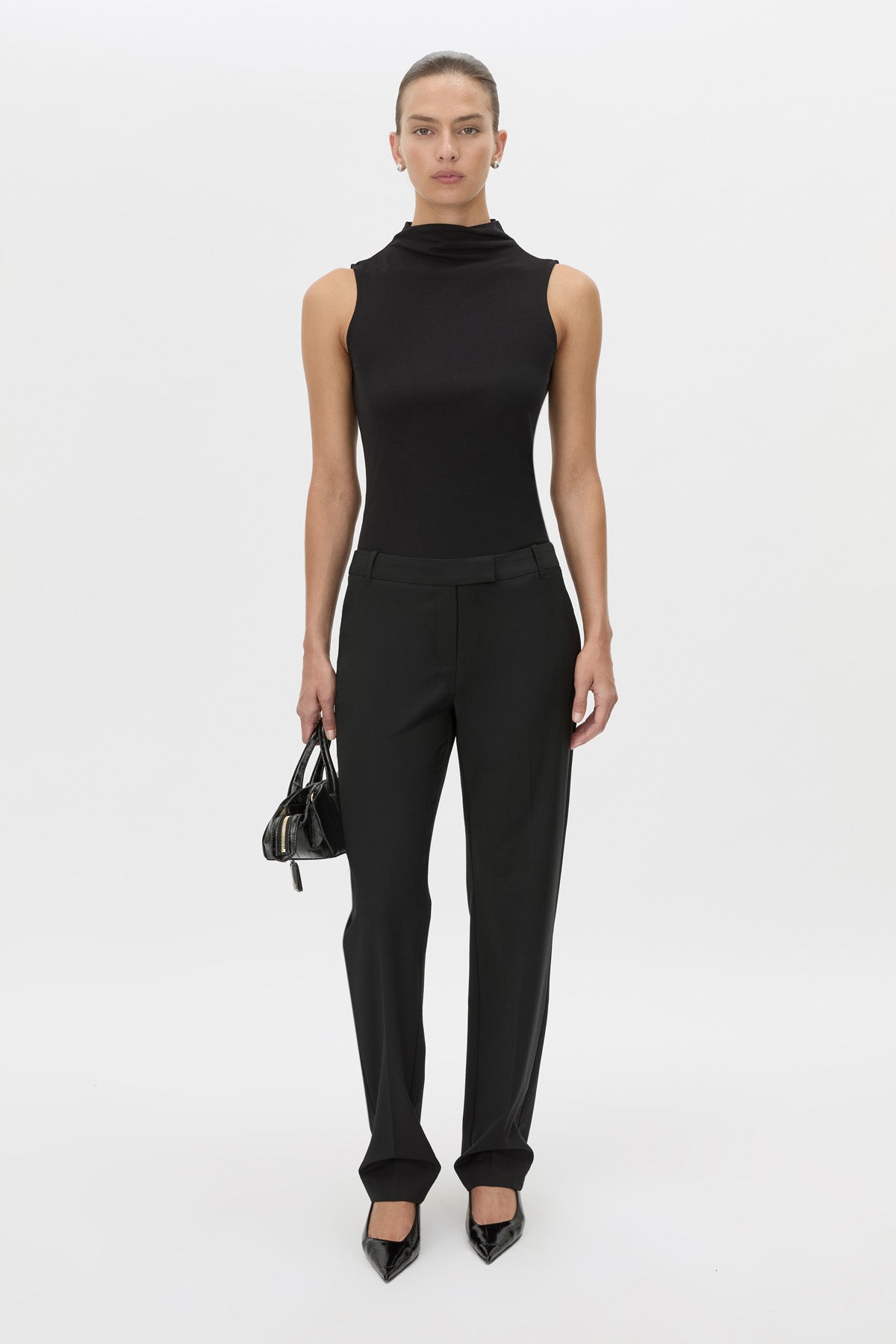 Front-styled view CAMILLA AND MARC Chiaro Slim-Fit Pant in black with low‑waisted, tailored waistband.