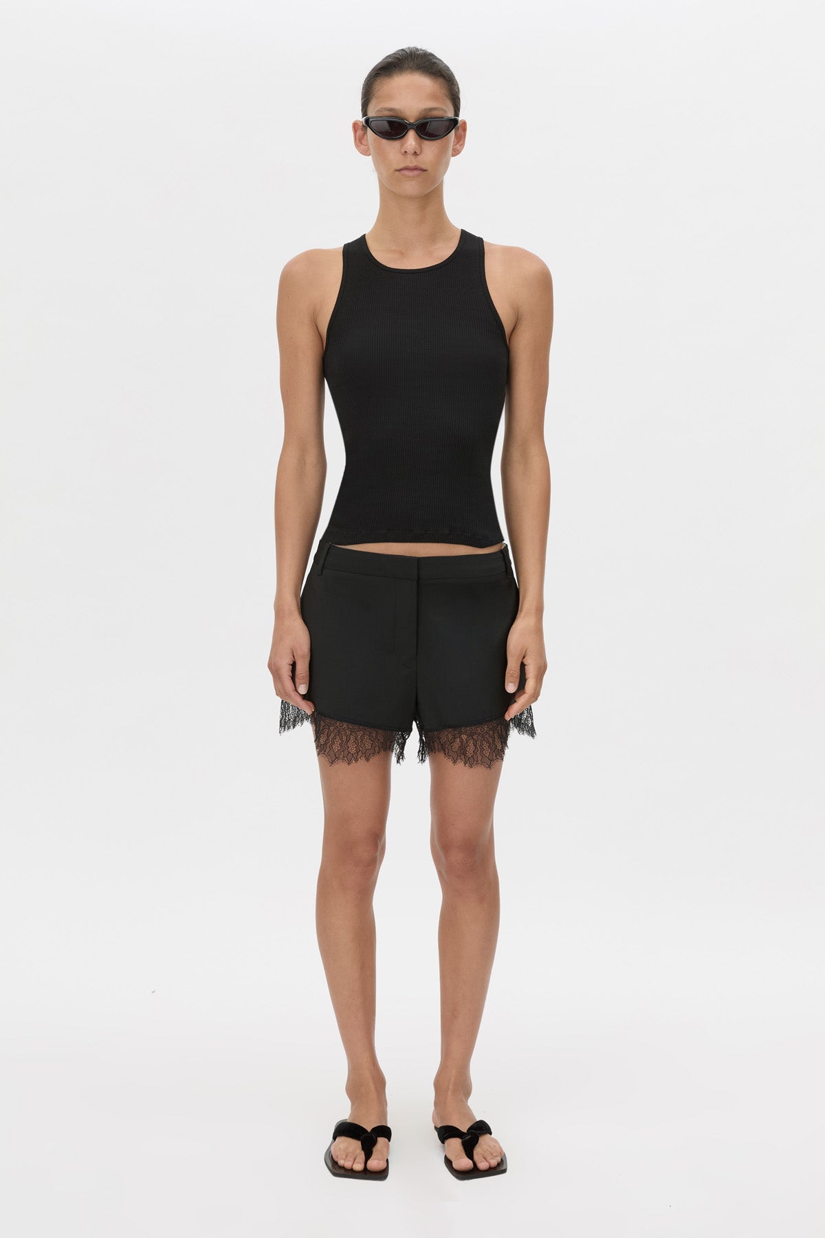 Front view CAMILLA AND MARC Chiaro Mini Short in black with lace hem detail.