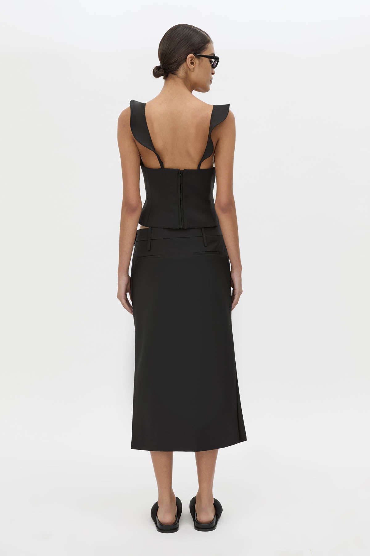 Back view CAMILLA AND MARC Chiaro Tailored Top in black with fluted ruffle straps.