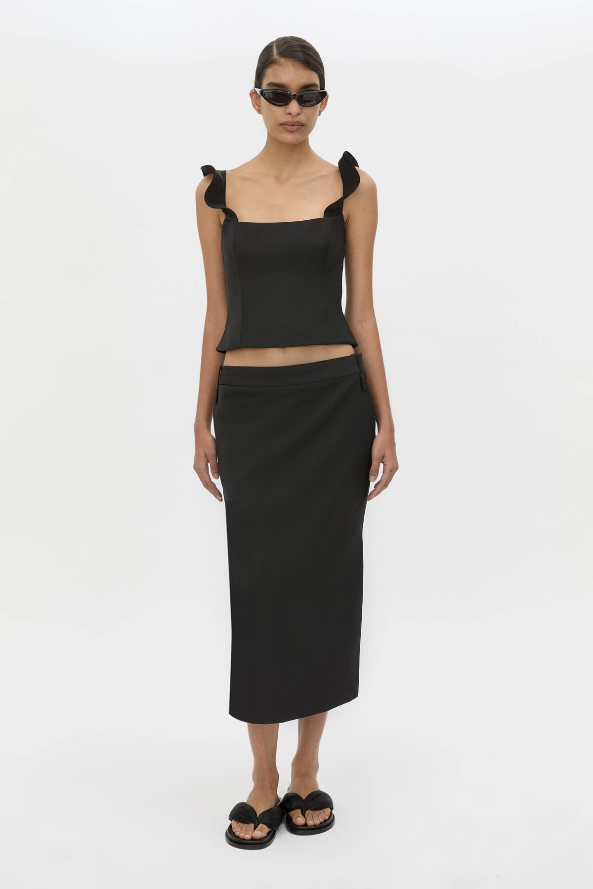 Front-styled view CAMILLA AND MARC Chiaro Tailored Top in black with fluted ruffle straps.