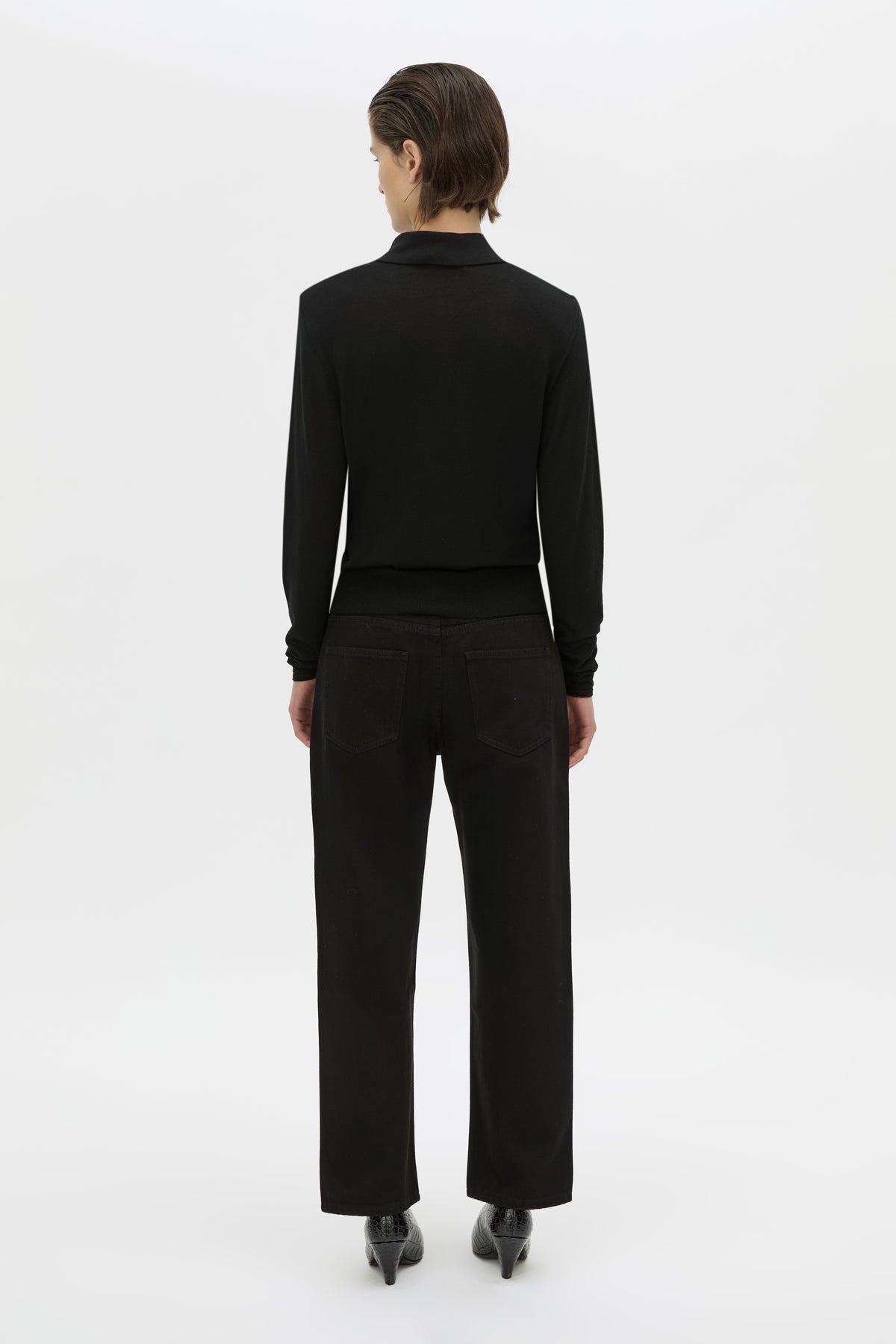 Back view CAMILLA AND MARC Chime long-sleeve merino wool knit polo top in black.